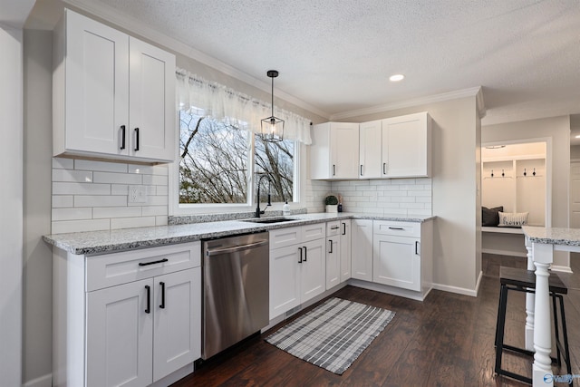 4018 SE Piedmont Dr, Huntsville, AL 35802 - kitchen featuring stainless steel dishwasher, dark wood-type flooring, a textured ceiling, and a sink