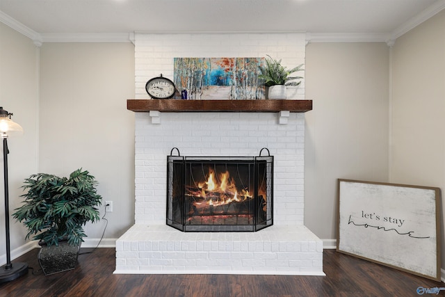 4018 SE Piedmont Dr, Huntsville, AL 35802 - details featuring a brick fireplace, baseboards, crown molding, and wood finished floors
