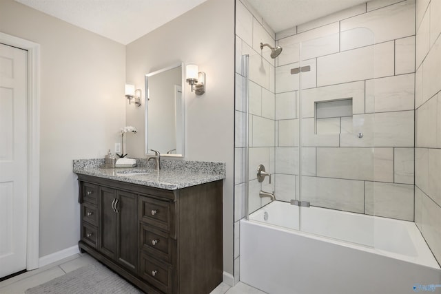 4018 SE Piedmont Dr, Huntsville, AL 35802 - bathroom with vanity, baseboards, tile patterned flooring, and shower / washtub combination