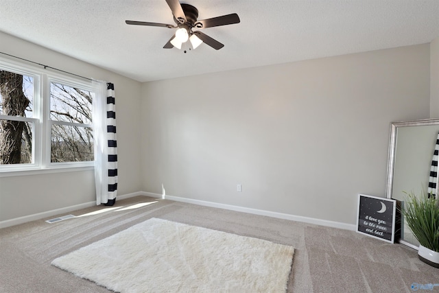 4018 SE Piedmont Dr, Huntsville, AL 35802 - empty room featuring visible vents, baseboards, a ceiling fan, and carpet