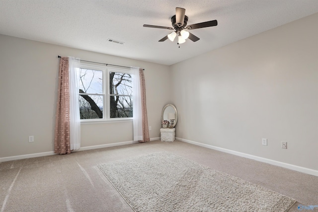4018 SE Piedmont Dr, Huntsville, AL 35802 - spare room featuring light carpet, visible vents, a textured ceiling, and ceiling fan