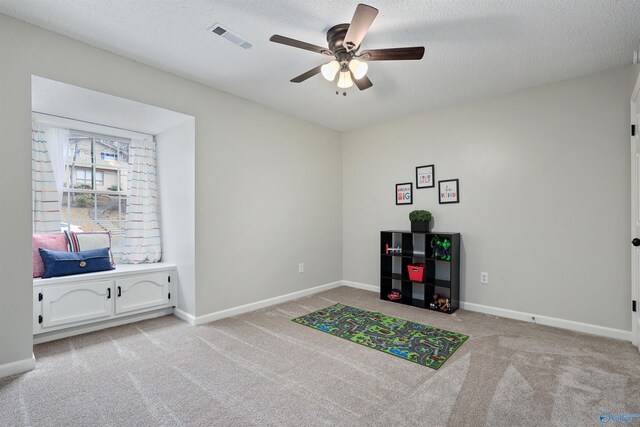 4018 SE Piedmont Dr, Huntsville, AL 35802 - game room with visible vents, ceiling fan, light colored carpet, and baseboards