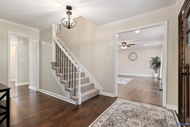 4018 SE Piedmont Dr, Huntsville, AL 35802 - entrance foyer with ceiling fan with notable chandelier, a textured ceiling, ornamental molding, stairway, and wood finished floors