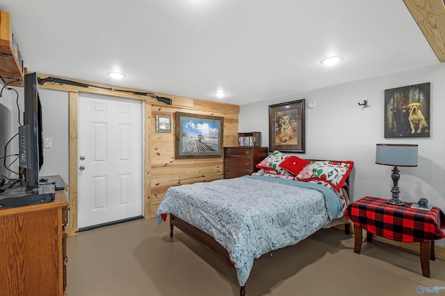 bedroom with wooden walls