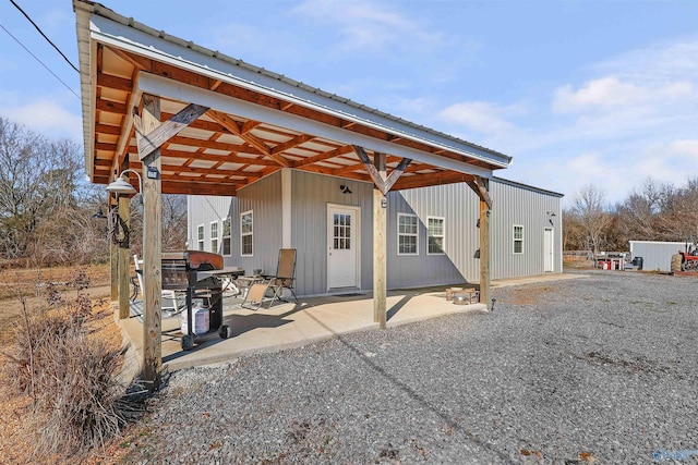 back of house with a patio