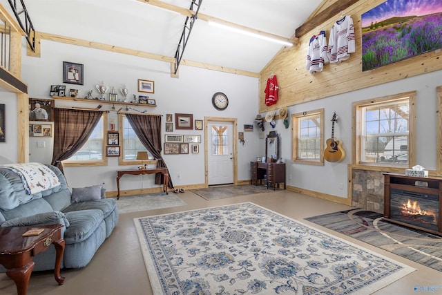 living room with beam ceiling and high vaulted ceiling