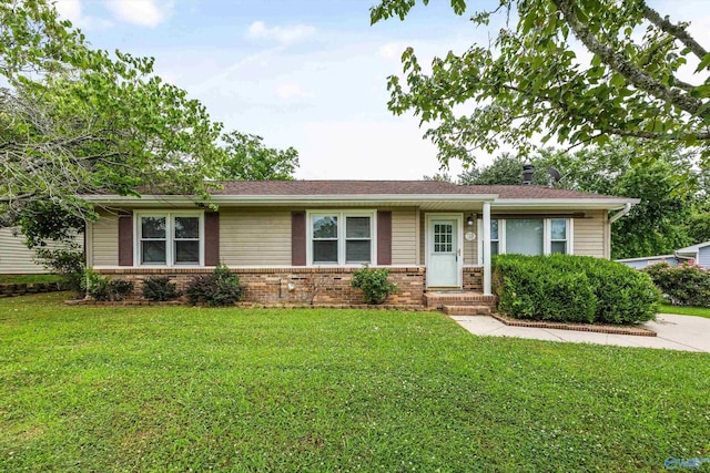 13935 SW Wyandotte Dr, Huntsville, AL 35803 - single story home featuring brick siding and a front yard