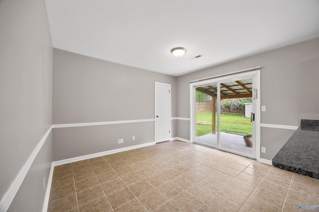 13935 SW Wyandotte Dr, Huntsville, AL 35803 - tiled empty room featuring baseboards