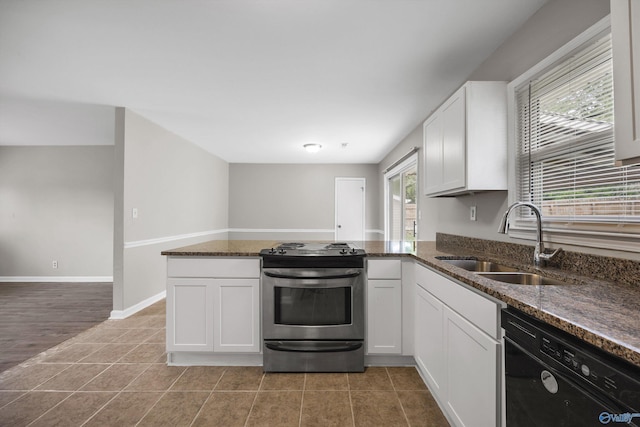 13935 SW Wyandotte Dr, Huntsville, AL 35803 - kitchen featuring stainless steel range, black dishwasher, white cabinets, dark stone countertops, and a peninsula
