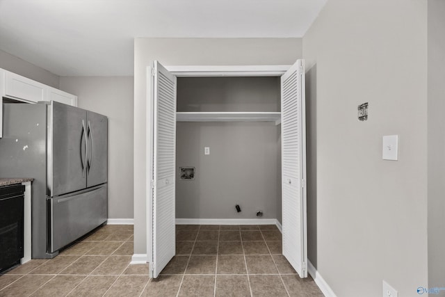 13935 SW Wyandotte Dr, Huntsville, AL 35803 - laundry room featuring washer hookup and light tile patterned flooring