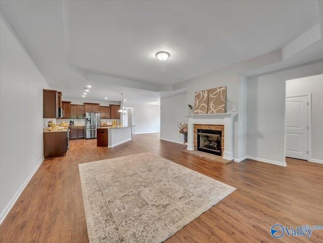 27004 Mill Creek Dr, Athens, AL 35613 - living area with baseboards, a stone fireplace, recessed lighting, and wood finished floors