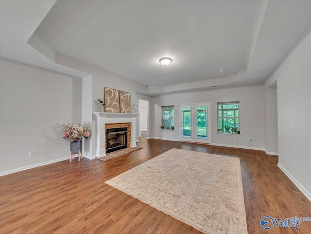 27004 Mill Creek Dr, Athens, AL 35613 - living room featuring baseboards, a stone fireplace, and wood finished floors