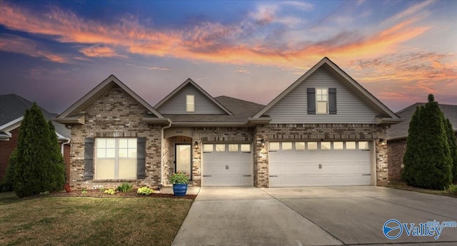 27004 Mill Creek Dr, Athens, AL 35613 - view of front of home with an attached garage, concrete driveway, a front yard, and brick siding