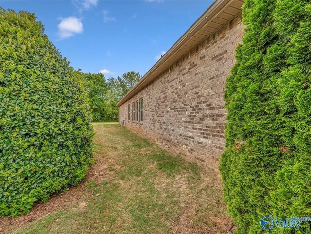 27004 Mill Creek Dr, Athens, AL 35613 - view of home's exterior featuring a lawn and brick siding