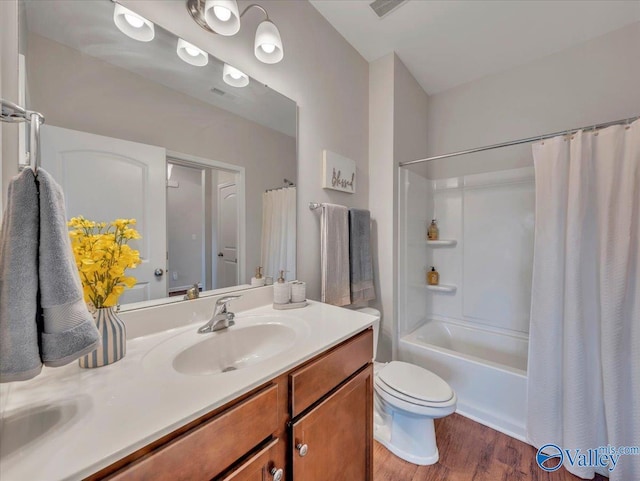 27004 Mill Creek Dr, Athens, AL 35613 - bathroom featuring vanity, shower / tub combo with curtain, visible vents, wood finished floors, and toilet