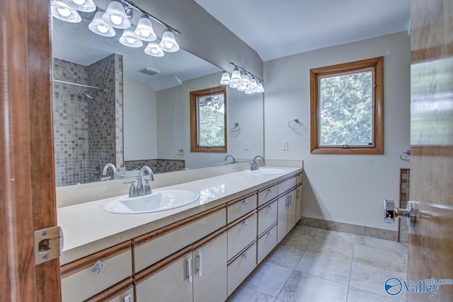 bathroom with tile patterned floors and vanity