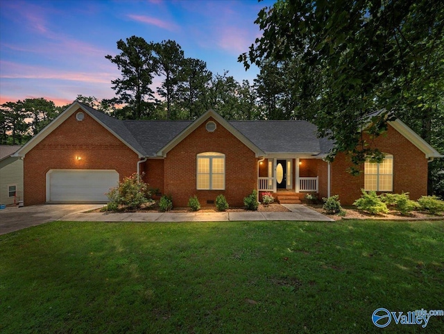 78 Bob Cir, Scottsboro, AL 35769 - ranch-style home with brick siding, a garage, a porch, driveway, and a lawn