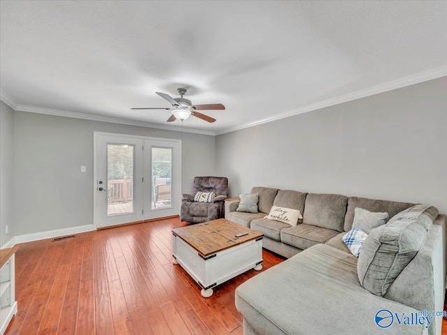 78 Bob Cir, Scottsboro, AL 35769 - living room with ceiling fan, hardwood / wood-style floors, crown molding, and baseboards