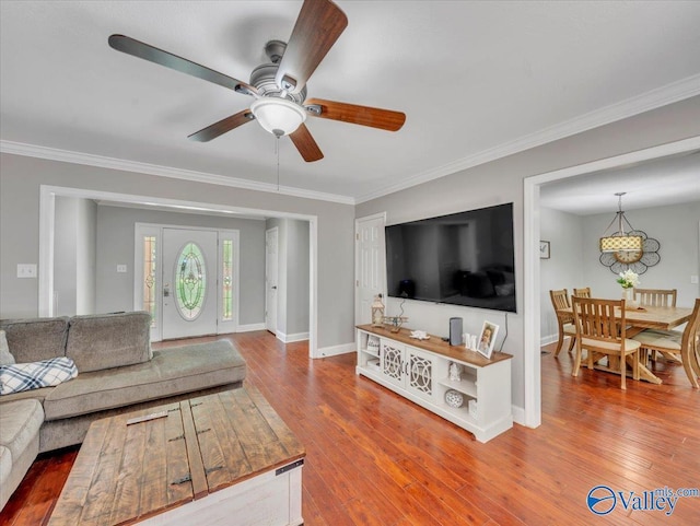 78 Bob Cir, Scottsboro, AL 35769 - living room featuring a ceiling fan, ornamental molding, wood-type flooring, and baseboards