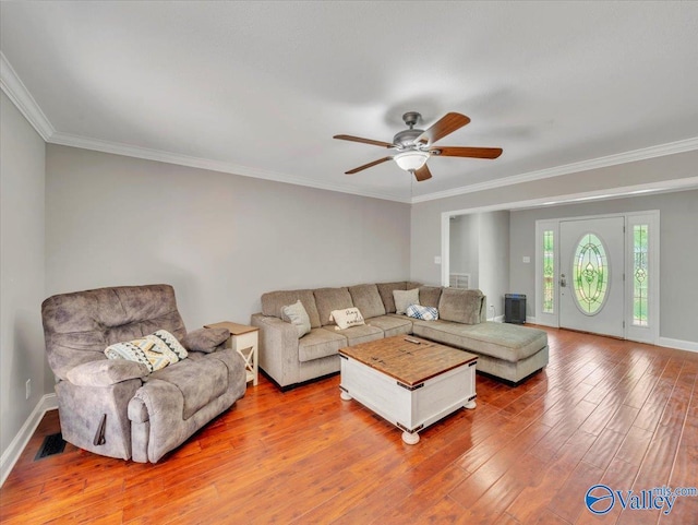 78 Bob Cir, Scottsboro, AL 35769 - living area featuring wood finished floors, a ceiling fan, crown molding, and baseboards