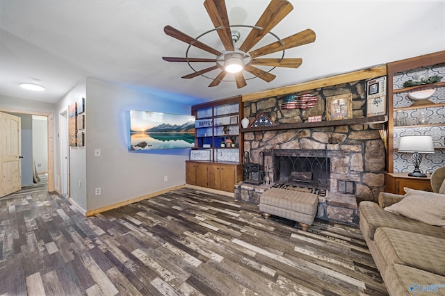 175 Short St, Geraldine, AL 35974 - living area with wood finished floors, baseboards, ceiling fan, and a fireplace