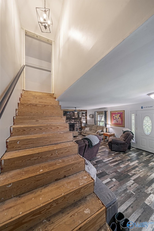 175 Short St, Geraldine, AL 35974 - stairway with wood finished floors and a chandelier