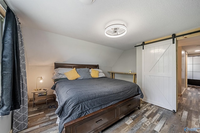 175 Short St, Geraldine, AL 35974 - bedroom featuring wood finished floors and a barn door
