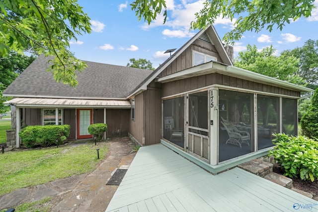 175 Short St, Geraldine, AL 35974 - view of front of property featuring a sunroom, a shingled roof, a front lawn, and a deck