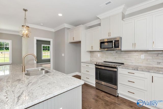 kitchen featuring stainless steel appliances, white cabinetry, sink, and dark hardwood / wood-style flooring