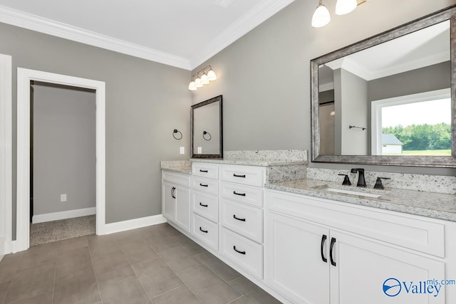 bathroom with tile patterned flooring, vanity, and crown molding