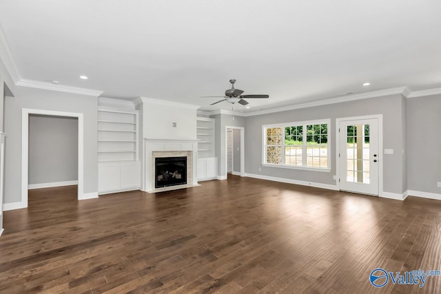 unfurnished living room with ceiling fan, dark hardwood / wood-style flooring, and ornamental molding