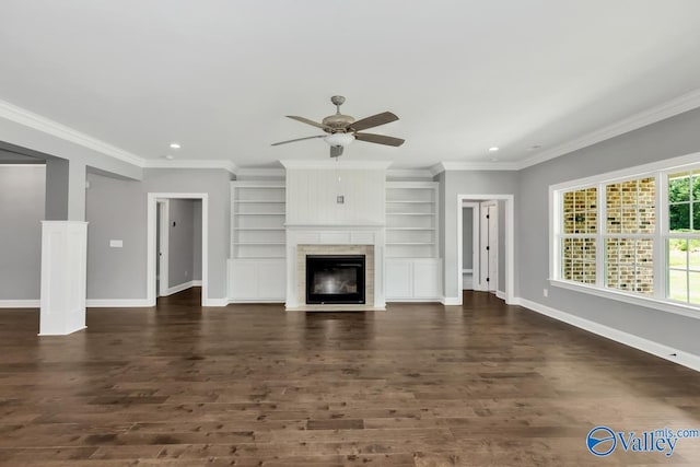 unfurnished living room with a fireplace, crown molding, and dark hardwood / wood-style flooring