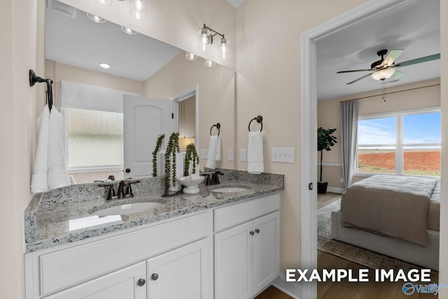 29555 Canoe Cir, Harvest, AL 35749 - ensuite bathroom with baseboards, double vanity, a sink, and a ceiling fan