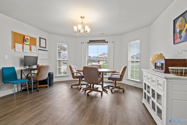 dining room with baseboards, dark wood-type flooring, and a notable chandelier