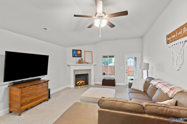 living room featuring vaulted ceiling, baseboards, visible vents, and light colored carpet