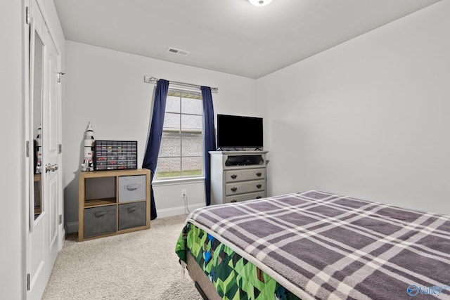 bedroom featuring carpet floors, baseboards, and visible vents