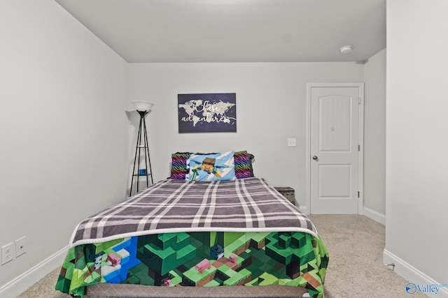 bedroom with carpet and baseboards