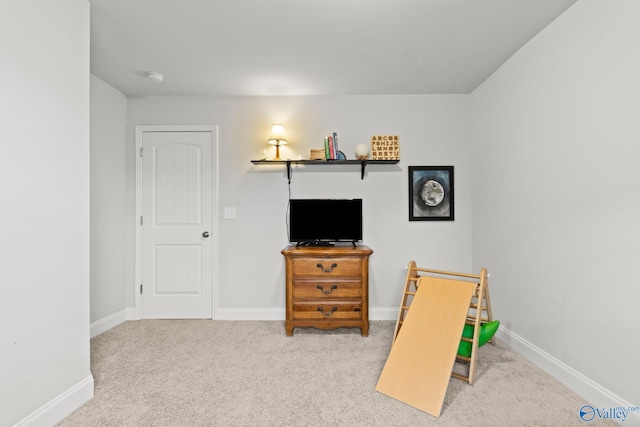 game room with carpet floors and baseboards