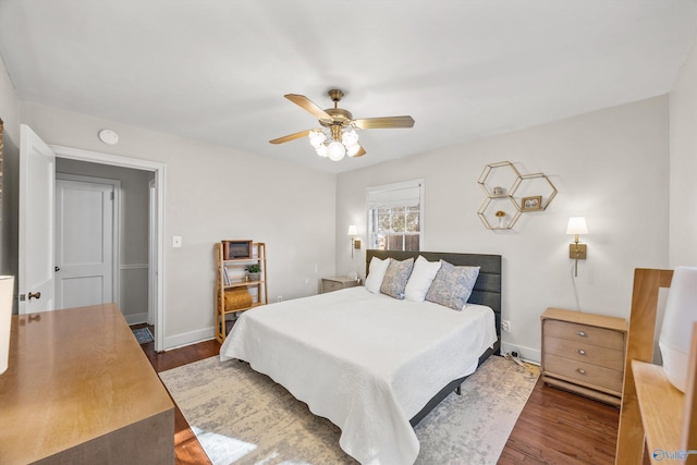 bedroom featuring dark wood-type flooring and ceiling fan