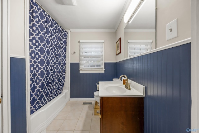 bathroom featuring ornamental molding, tile patterned floors, vanity, and shower / bath combo