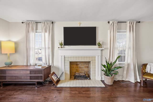 sitting room featuring hardwood / wood-style flooring and a fireplace