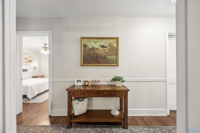 hallway with dark wood-type flooring