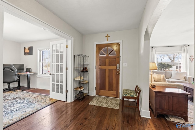 entryway with dark hardwood / wood-style floors