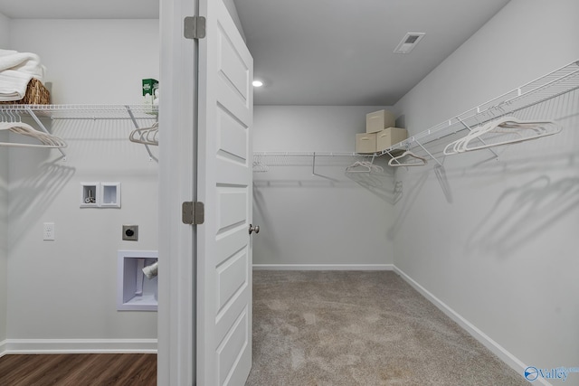 walk in closet featuring visible vents