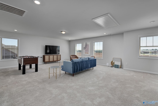 living room with visible vents, attic access, baseboards, and recessed lighting