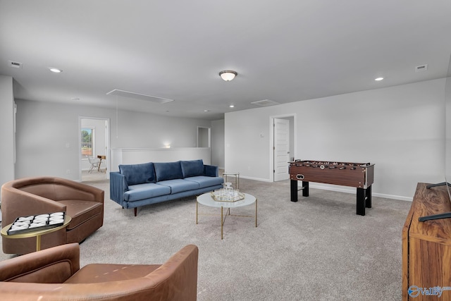 carpeted living room featuring recessed lighting, baseboards, visible vents, and attic access