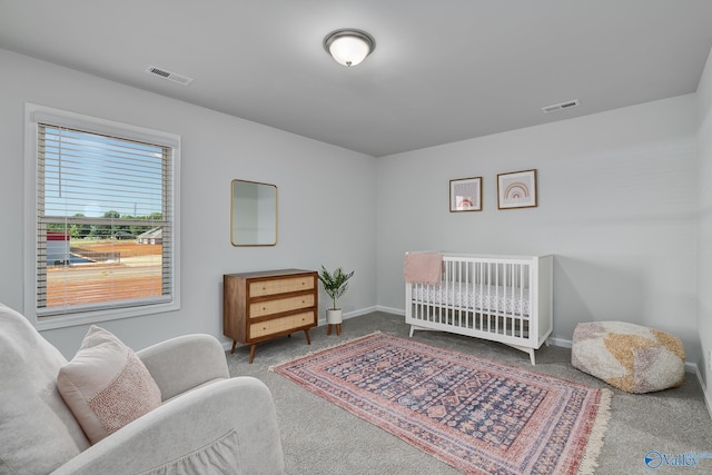 bedroom featuring baseboards, carpet flooring, and visible vents