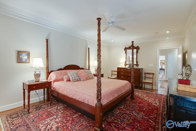 bedroom featuring ceiling fan, wood-type flooring, and crown molding