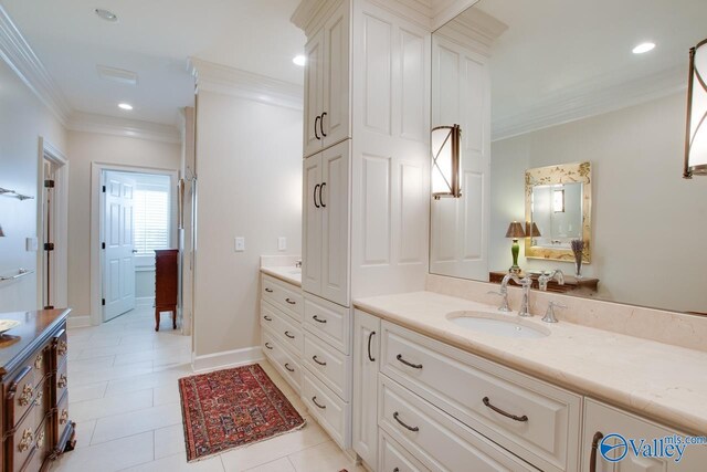 bathroom with ornamental molding, tile patterned flooring, and vanity