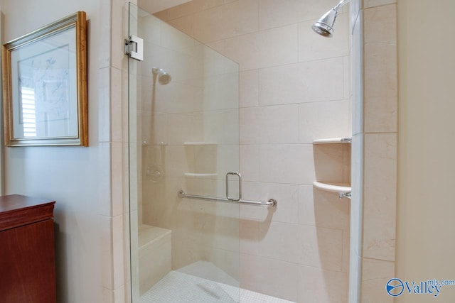 bathroom featuring a shower with door